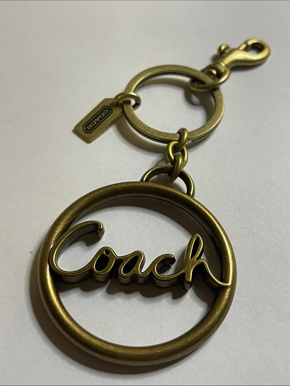 Coach Large Brass-Tone Script Circle Keyring/Bag Charm
